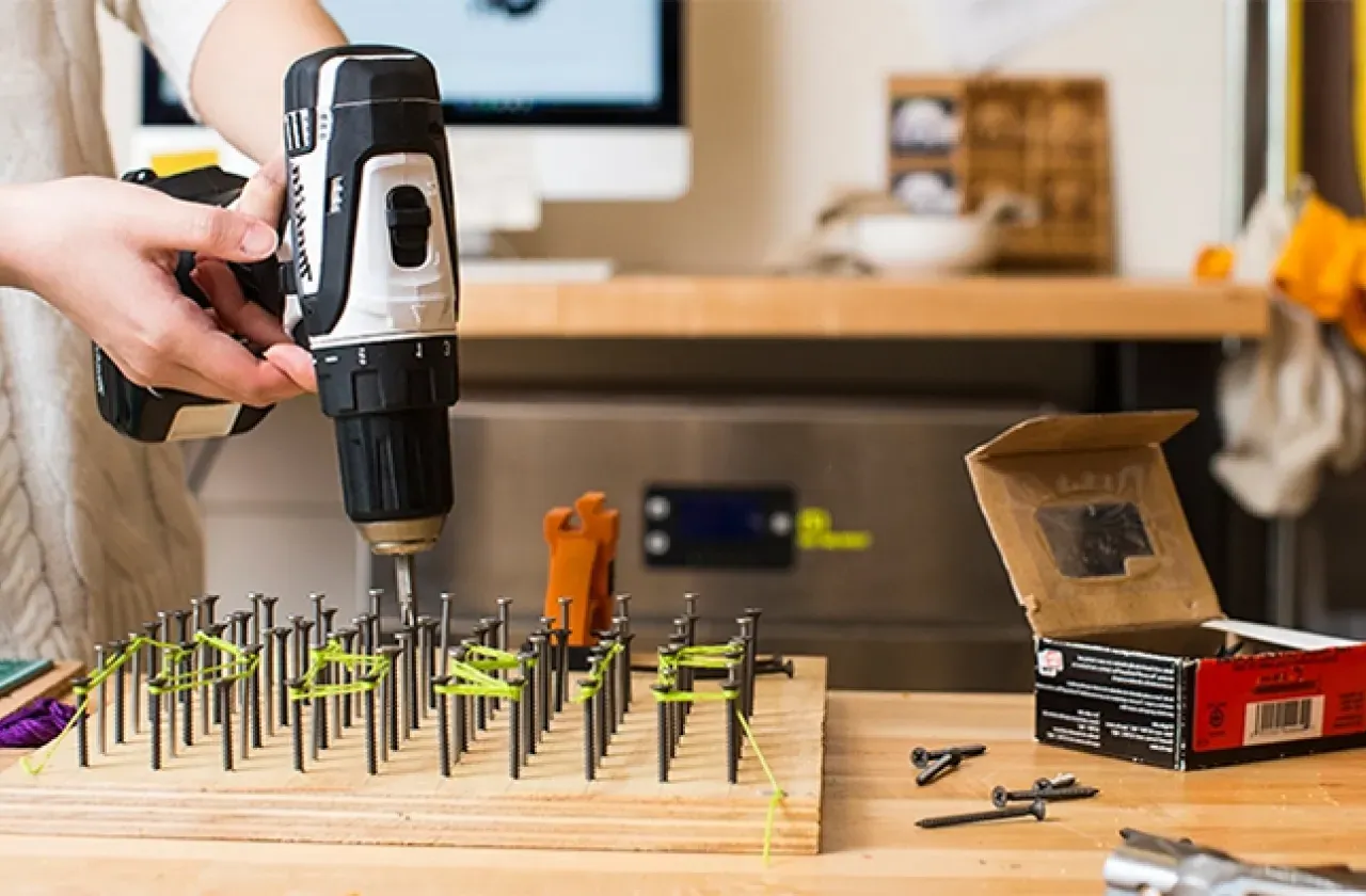 Student holding a drill